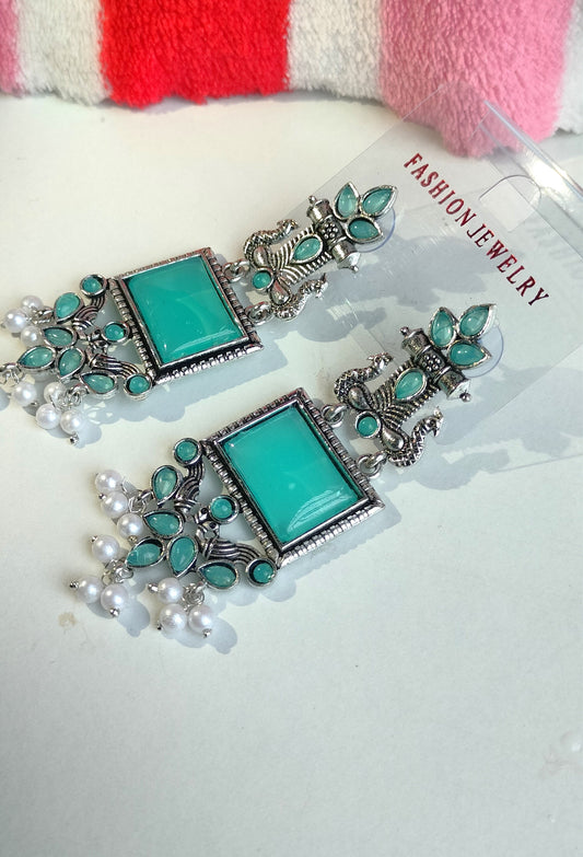 Oxidized Silver Peacock Dangler Earrings with Rama Green Stone & Pearl Drops – Ethnic Party Wear Jewelry for Women