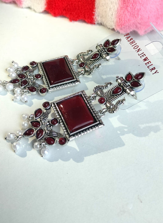 Oxidized Silver Peacock Dangler Earrings with Maroon Stone & Pearl Drops – Ethnic Party Wear Jewelry for Women