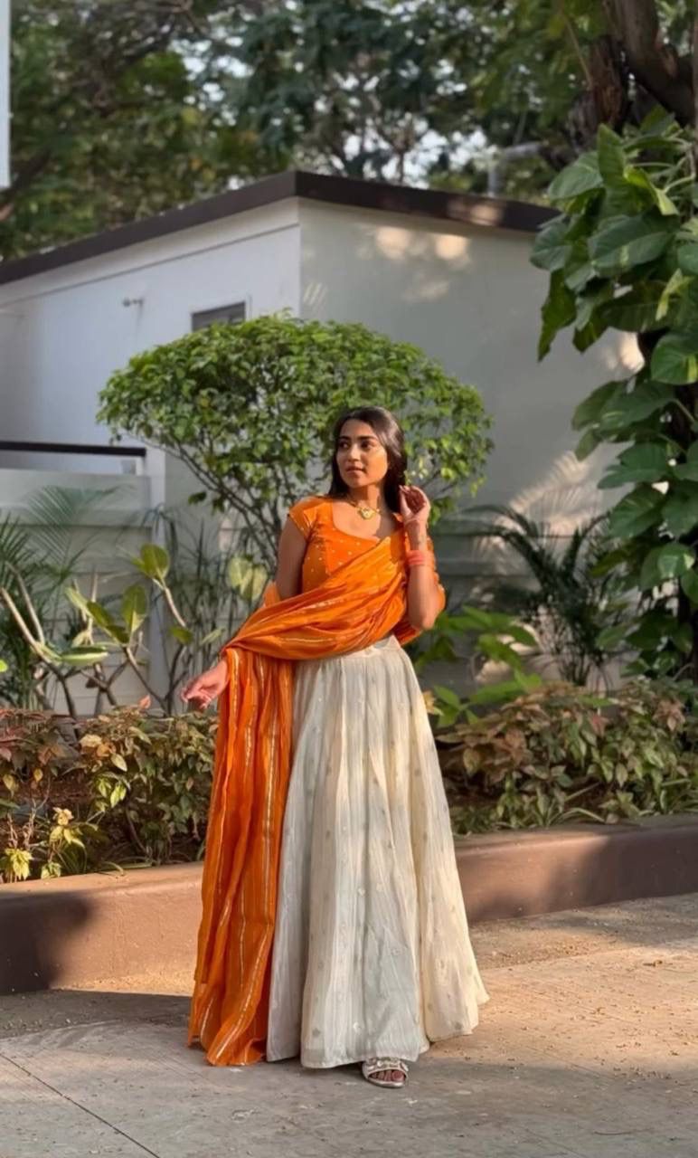 Latest Orange and White Colored Jacquard Silk Festive Lehenga Choli