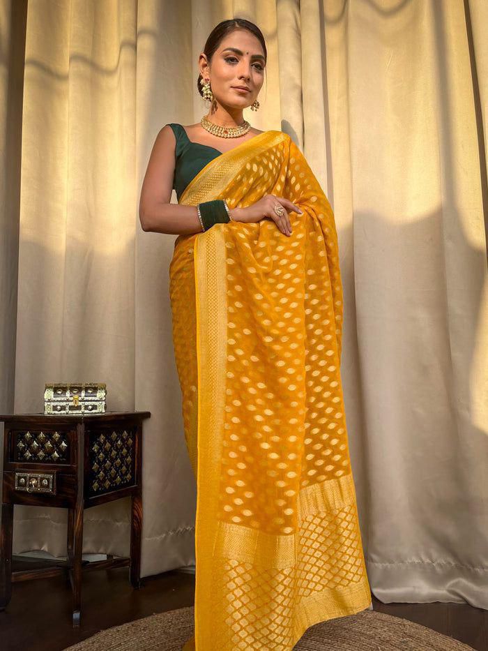 Embracing Yellow Colored Soft Lichi Silk Saree with Heavy Jacquard Work & Rich Border