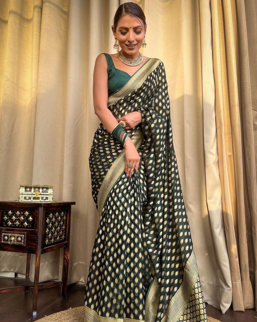 Embracing Dark Green Colored Soft Lichi Silk Saree with Heavy Jacquard Work & Rich Border